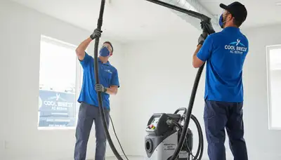 Technician cleaning air ducts for improved airflow and indoor air quality in Omaha, NE
